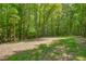 Lush backyard offering ample green space and a tranquil, natural setting at 40 Otter Ct, Youngsville, NC 27596
