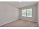 Bedroom featuring neutral colored walls and carpet with a window at 40 Otter Ct, Youngsville, NC 27596