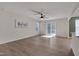 Spacious living room with hardwood floors, natural light, and modern ceiling fan at 40 Otter Ct, Youngsville, NC 27596