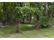 Charming backyard arbor covered in lush greenery, creating a whimsical outdoor feature at 404 Denton St, Durham, NC 27713