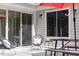 Back deck featuring modern chairs, a table, and sliding glass doors leading indoors at 404 Denton St, Durham, NC 27713