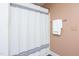 Bathroom with a striped shower curtain and a towel rack at 404 Denton St, Durham, NC 27713