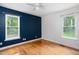 Bedroom features two windows and neutral paint colors and hardwood floors at 404 Denton St, Durham, NC 27713