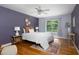 Bedroom with ceiling fan, natural light, and stylish decor at 404 Denton St, Durham, NC 27713