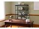 Bright home office featuring a wooden desk, shelving, and a sunlit window at 404 Denton St, Durham, NC 27713
