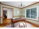 Home office with wood trim, decorative rug, window, and chandelier lighting at 404 Denton St, Durham, NC 27713