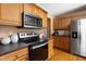 Kitchen features stainless steel appliances and wooden cabinetry at 404 Denton St, Durham, NC 27713