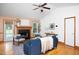 Spacious living room with vaulted ceilings, hardwood floors, fireplace, and comfortable seating area with natural light at 404 Denton St, Durham, NC 27713