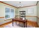 Home office featuring a vintage desk, natural light, and stylish decor for a productive workspace at 404 Denton St, Durham, NC 27713