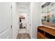 Bright hallway featuring an entryway closet for shoes and accessories, seamlessly blending functionality with style at 404 Porterfield Dr, Youngsville, NC 27596