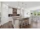 Bright kitchen featuring a large island with seating, pendant lighting, and modern appliances at 404 Porterfield Dr, Youngsville, NC 27596