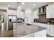 Bright kitchen showcasing stainless steel appliances, a spacious island, and modern fixtures at 404 Porterfield Dr, Youngsville, NC 27596