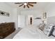 Comfortable main bedroom featuring a queen bed, ample lighting, dresser, and a doorway to the ensuite bathroom at 404 Porterfield Dr, Youngsville, NC 27596