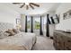 Serene main bedroom boasts a cozy bed, bay windows with natural light, and a stylish dresser for ample storage at 404 Porterfield Dr, Youngsville, NC 27596