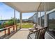 Relaxing screened-in porch with comfortable seating and a view of the backyard at 404 Porterfield Dr, Youngsville, NC 27596