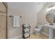 Bathroom with a shower, sink, and toilet, as well as a rack of neatly folded, fluffy white towels at 404 Wanderview Ln, Holly Springs, NC 27540