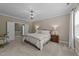Inviting bedroom featuring soft carpet and neutral tones at 404 Wanderview Ln, Holly Springs, NC 27540
