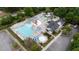 A vibrant community pool features a slide, separate splash area, and plenty of lounge chairs at 404 Wanderview Ln, Holly Springs, NC 27540