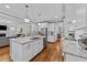 Spacious kitchen featuring a large island, stainless steel appliances, and an open layout at 404 Wanderview Ln, Holly Springs, NC 27540