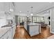 Open kitchen layout with island, stainless appliances, open to dining and living areas at 404 Wanderview Ln, Holly Springs, NC 27540