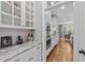 Elegant kitchen features granite counters, stainless appliances, and ample cabinet space at 404 Wanderview Ln, Holly Springs, NC 27540