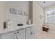 Bright laundry room with ample counter space and storage at 404 Wanderview Ln, Holly Springs, NC 27540