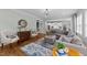Open-concept living room showcasing a cozy seating area and seamless flow to the kitchen at 404 Wanderview Ln, Holly Springs, NC 27540