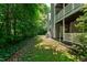 Backyard with AC and trees at 407 Gooseneck Dr # B1, Cary, NC 27513