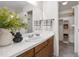 Bright bathroom featuring modern vanity, mirror, towels, and walk-in closet at 407 Gooseneck Dr # B1, Cary, NC 27513