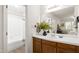 Classic bathroom with wooden cabinets and a large mirror at 407 Gooseneck Dr # B1, Cary, NC 27513