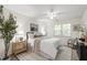 Calming bedroom featuring a ceiling fan and large windows at 407 Gooseneck Dr # B1, Cary, NC 27513
