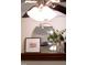 Close up on decorative fireplace mantle and mirror accents above fireplace at 407 Gooseneck Dr # B1, Cary, NC 27513