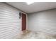 Private condo entrance with a modern door and a cozy welcome mat at 407 Gooseneck Dr # B1, Cary, NC 27513