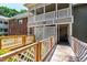 Inviting condo entrance featuring lattice, wooden accents, and a cozy outdoor seating area at 407 Gooseneck Dr # B1, Cary, NC 27513