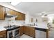 Updated kitchen featuring stainless steel appliances and light countertops at 407 Gooseneck Dr # B1, Cary, NC 27513