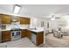 Efficient kitchen with stainless steel appliances open to the living space at 407 Gooseneck Dr # B1, Cary, NC 27513