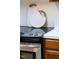Close-up of the kitchen range with decorative cutting boards at 407 Gooseneck Dr # B1, Cary, NC 27513