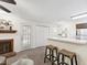 Bright living room with a cozy fireplace and a view to the outdoor patio at 407 Gooseneck Dr # B1, Cary, NC 27513