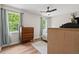 Bedroom with great natural light, ceiling fan, and wood-look flooring at 411 Buxton St, Durham, NC 27713