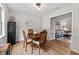 This charming dining room features hardwood floors, a round wooden table, and stylish decor, perfect for cozy meals at 411 Buxton St, Durham, NC 27713