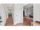 Welcoming entryway featuring wood flooring and access to the living room at 411 Buxton St, Durham, NC 27713