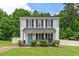 Charming two-story home with a manicured front yard and inviting front porch at 411 Buxton St, Durham, NC 27713