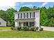Charming two-story home with a manicured front yard and inviting front porch at 411 Buxton St, Durham, NC 27713