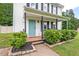 Inviting front porch with rocking chairs and beautiful landscaping at 411 Buxton St, Durham, NC 27713