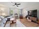 Cozy living room featuring wood floors, large windows, and modern furnishings at 411 Buxton St, Durham, NC 27713