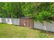 A storage shed located in a fenced backyard, ideal for storing lawn equipment and outdoor tools at 411 Buxton St, Durham, NC 27713