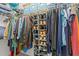Organized closet with hanging clothes and shoe storage at 4124 Sykes St, Cary, NC 27519
