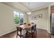 Sunlit dining area with wood table, seating for six, and a large window view at 4124 Sykes St, Cary, NC 27519