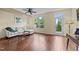 Living room with hardwood floors, large window, and comfortable seating area at 4124 Sykes St, Cary, NC 27519