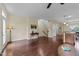 Open-concept living space with hardwood floors and neutral paint palette throughout home at 4124 Sykes St, Cary, NC 27519
